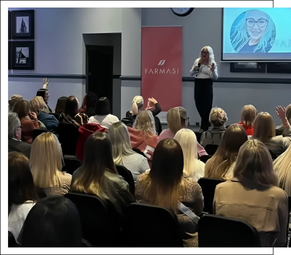 Woman presenting to seated crowd